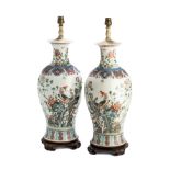 A LARGE PAIR OF CHINESE FAMILLE ROSE BALUSTER VASES MOUNTED AS LAMPS