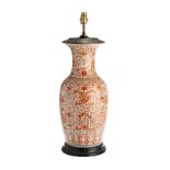 A CHINESE IRON-RED BALUSTER VASE MOUNTED AS A LAMP