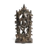 AN UNUSUAL BRONZE SHRINE DEPICTING KRISHNA PLAYING HIS FLUTE