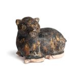 A KHMER BROWN GLAZED FIGURE OF A PIG