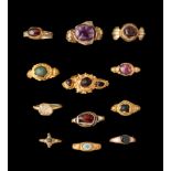 TWELVE GEM-SET GOLD RINGS