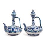 A PAIR OF BOMBAY SCHOOL OF ART ORNAMENTAL EWERS