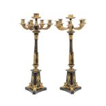 A PAIR OF FRENCH EMPIRE ORMOLU AND PATINATED BRONZE CANDELABRA