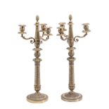 A PAIR OF SILVERED THREE-LIGHT CANDELABRA