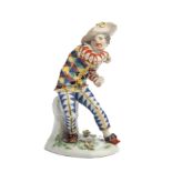 A MEISSEN FIGURE OF THE FRIGHTENED HARLEQUIN