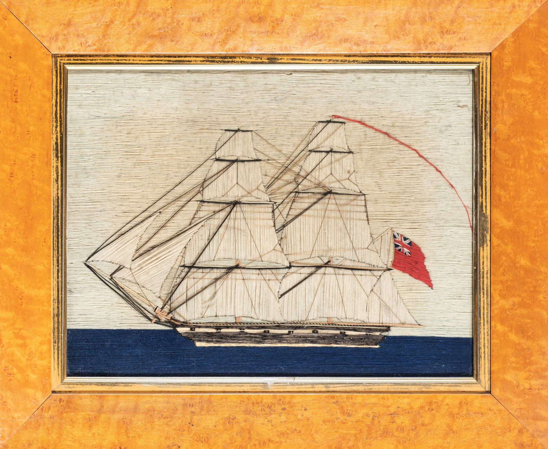 A SAILOR 'S WOOLWORK PICTURE OF A BRIG