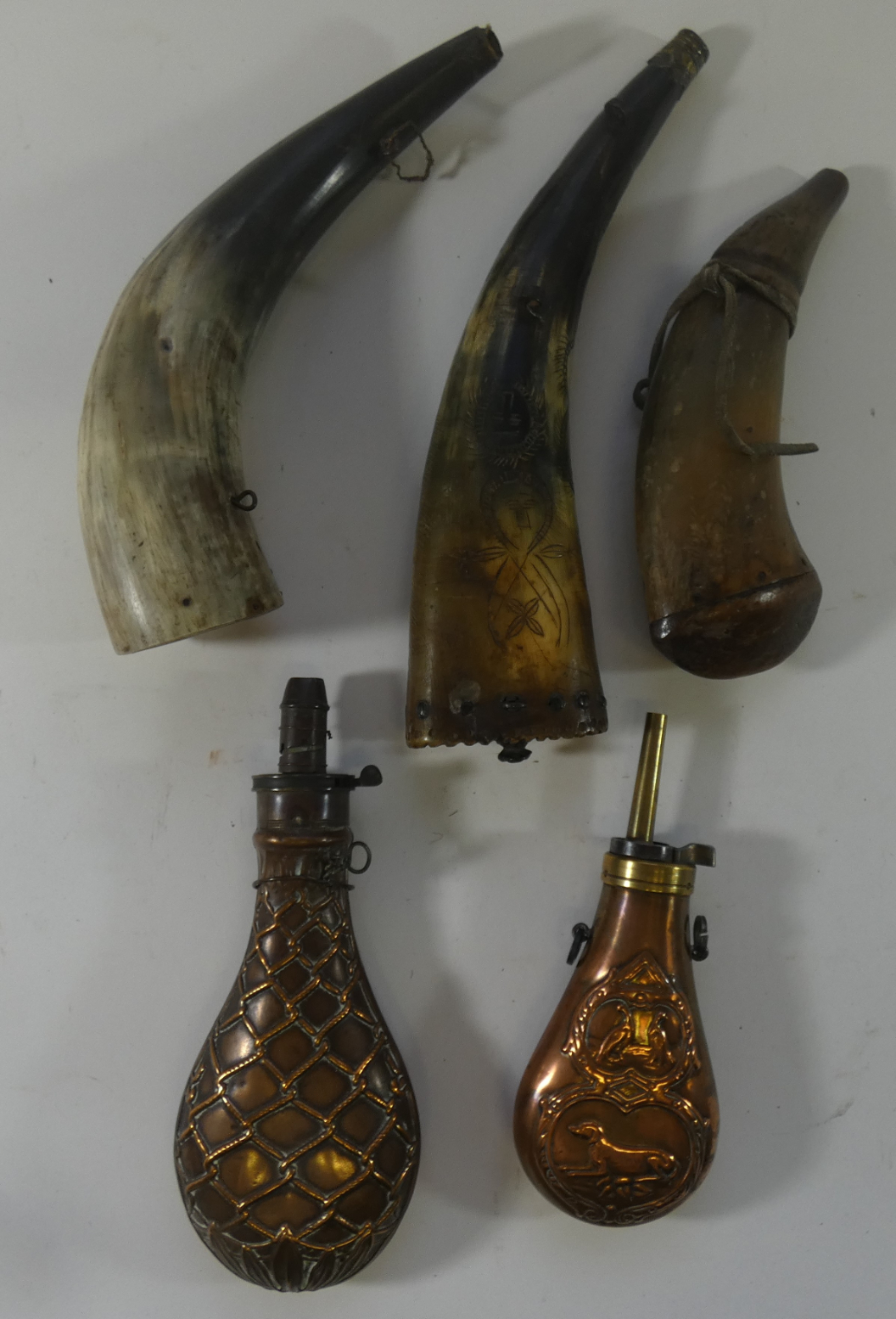 THREE HORN FLASKS AND TWO COPPER POWDER-FLASKS