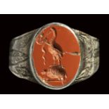 A roman red jasper intaglio mounted on a silver ring. Ibis on a turtle with a snake. 2nd cen