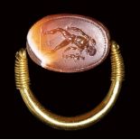 A fine etruscan banded agate scarab intaglio set in a swivel gold ring. Hermes Psychopomp.4t