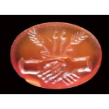 An italic carnelian intaglio. Dextrarum junctio. 1st century B.C. - 1st century A.D.