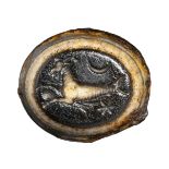 A roman agate intaglio. Seagoat with astrological attributes. 1st century A.D.