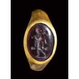 A late italic garnet intaglio set in a gold ring. Omphale. 2nd - 1st century B.C.