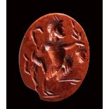 A roman red jasper intaglio. Pan. 2nd - 3rd century A.D.
