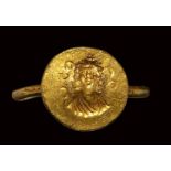 A byzantine gold engraved ring. Frontal portrait bust.6th - 7th century A.D.