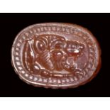 An etruscan carnelian engraved scarab. Lion forepart.Late 6th - early 5th century B.C.