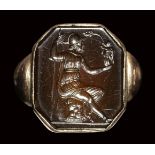 An octagonal sard intaglio set in a gold ring. Athena.18th - 19th century.