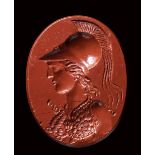 A large greek hellenistic red jasper intaglio. Bust of Athena. 3rd century B.C.