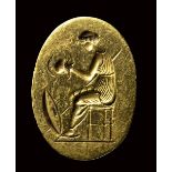 A fine classical greek engraved gold ring. Seated Athena with weapons. Late 5th - early 4th