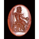 A roman carnelian intaglio. Seated Zeus.2nd century A.D.