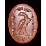 A roman carnelian intaglio. Emblema of victory with eagle and latin letters. 2nd century A.D