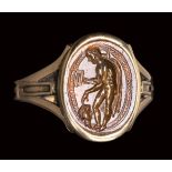An italic sard intaglio set in a gold ring. Hermes psychopomp.2nd century B.C.