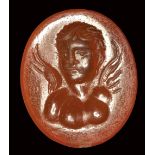 A roman carnelian intaglio. Bust of Eros.Late 1st century B.C. - Early 1st century A.D.