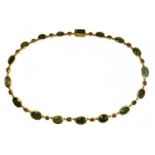 A fine gold necklace with 17 roman green chalcedony intaglios and rubies. Various subject. S