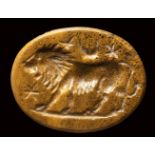 A roman yellow jasper magical intaglio. Lion with moon and stars. 2nd - 3rd century A.D.