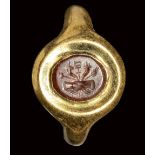 A roman carnelian intaglio set in a gold ring. Dextrarum Junctio. 2nd century A.D.