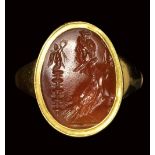 A roman carnelian intaglio set in a gold ring. Allegory of Zeus Sarapis. 2nd - 3rd century A