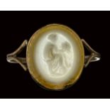 A roman two-layered agate intaglio mounted on an early 19th century gold ring. Muse with mask.
