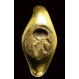 A roman jasper intaglio mounted in a later gold ring. Helmet. 1st - 2nd A.D.