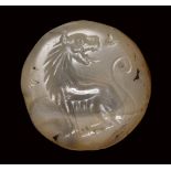 A greek lentoid chalcedony seal intaglio. Lioness.Late 2nd millenium B.C. - Early 1st millen