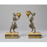 Couple of candelabra with satyrs