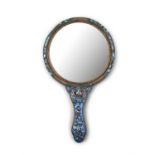 AN ENAMELLED COPPER HAND / FACE MIRROR China, Circa 1920s Richly adorned in blue and purple