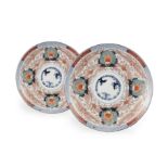 A PAIR OF IMARI ‘THREE FRIENDS OF WINTER’ PORCELAIN DISHES Japan, Meiji period One with an old
