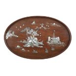 $A MOTHER OF PEARL INLAID WOODEN TRAY Vietnam, Tonkin, Nam Dinh, 19th century Of ovate shape,