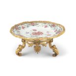 AN ORMOLU MOUNTED CHINESE EXPORT ‘FLOWER’ PORCELAIN PLATE The porcelain: China for Europe,