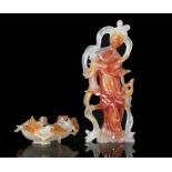 A GROUP OF TWO (2) AGATE CARVINGS China, 20th century One is a carving of a standing meiren
