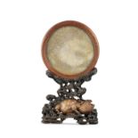 A SERPENTINE / SOAPSTONE ‘CRANE AND DRAGON’ MIRROR TOGETHER WITH AN INTRICATELY CARVED