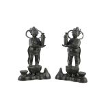 A LARGE MIRROR PAIR OF STANDING BRONZE ATTENDANTS China, Ming Dynasty, 16th to 17th century H: 34