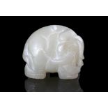 A WHITE JADE ‘ELEPHANT’ TOGGLE China, 20th century Naturalistically carved as an elephant