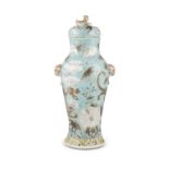 A CHINESE TURQUOISE GROUND OVAL VASE AND COVER, the cover with gilded fo-dog finial and with