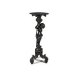 A VENETIAN EBONISED FIGURAL JARDINIERE STAND, 19th century, the disc top supported by a carved