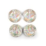 FOUR CHINESE FAMILLE ROSE PORCELAIN CIRCULAR DISHES, the reserves decorated with figural scenes