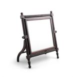 AN IRISH GEORGE IV MAHOGANY TOLIET MIRROR, with plain adjustable glass plate, supported within rope