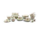 A COALPORT PORCELAIN PART TEA SERVICE, decorated with green quatrefoil motifs and flowers