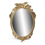 A LARGE GILTWOOD FRAMED OVAL WALL MIRROR, with bead and bellflower frame decorated with quivers,