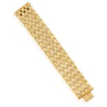 A GOLD BRACELET, of openwork polished and brushed 14K gold links, length 19cm, total gross weight