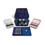 A COLLECTION, comprising two cased sets of six pastry forks; a cased set of five electroplated